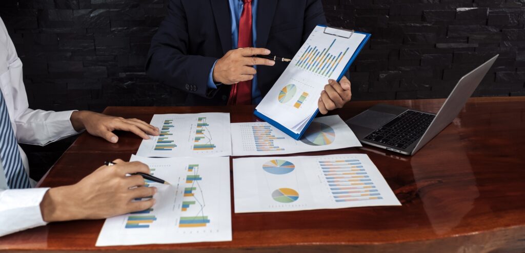 businessmen team meeting to plan strategies to increase business income. Have a brainstorming graph