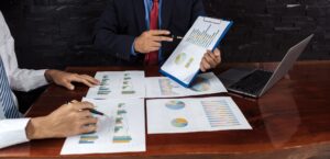 businessmen team meeting to plan strategies to increase business income. Have a brainstorming graph
