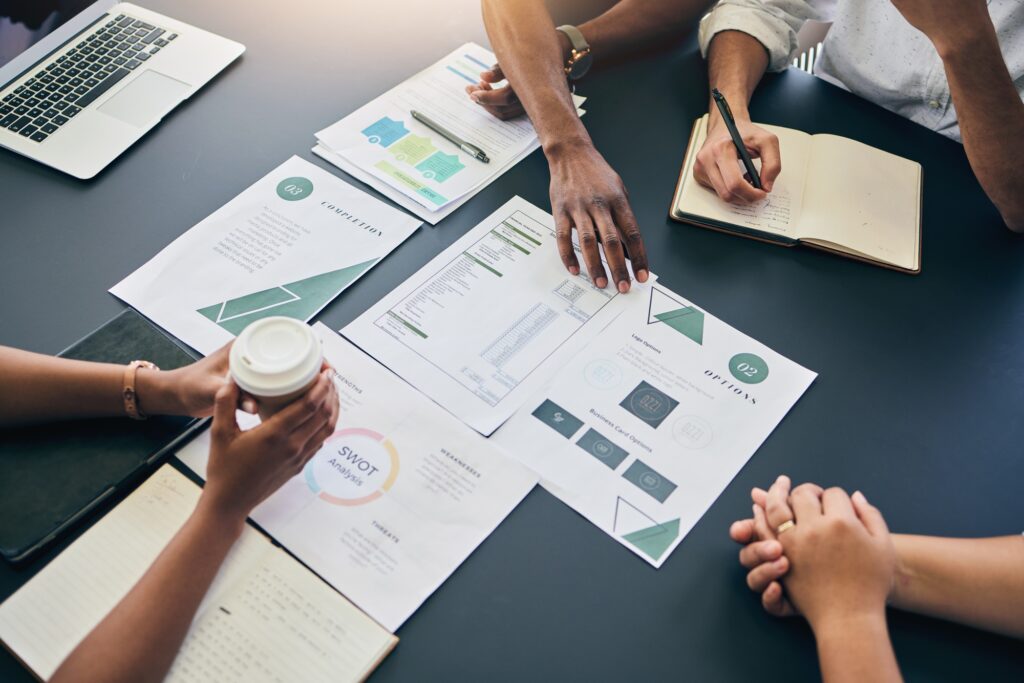 Planning, meeting and above business people with marketing strategy, report and employees brainstor