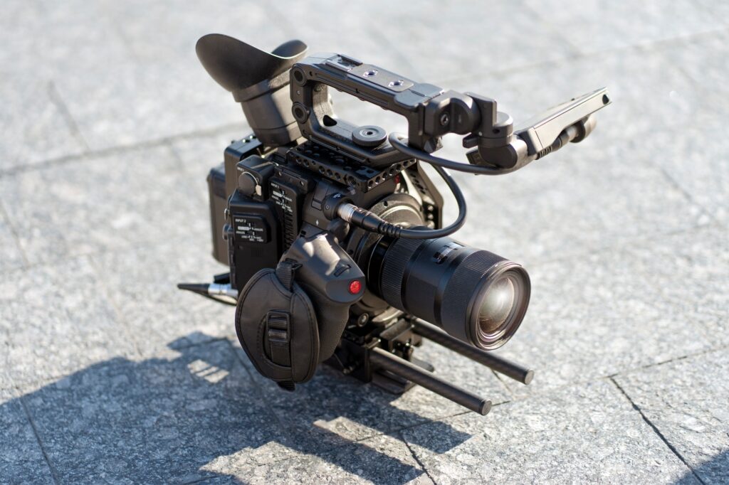 Professional video equipment standing at the ground in city. Professional production camera