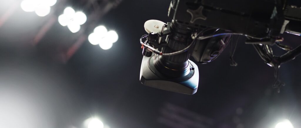 TV Camera broadcast on the crane tripod for shooting or recording and broadcasting content in studio